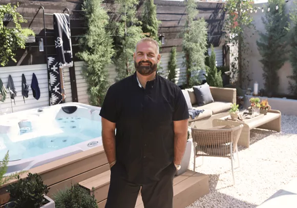 James DeSantis Standing In A Backyard He Designed