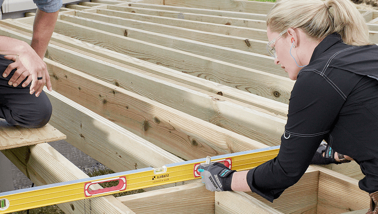 Image Framing And Construction Category Builders Checking That Deck Frame Is Level 2X