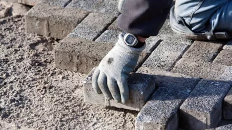Person Laying Brick