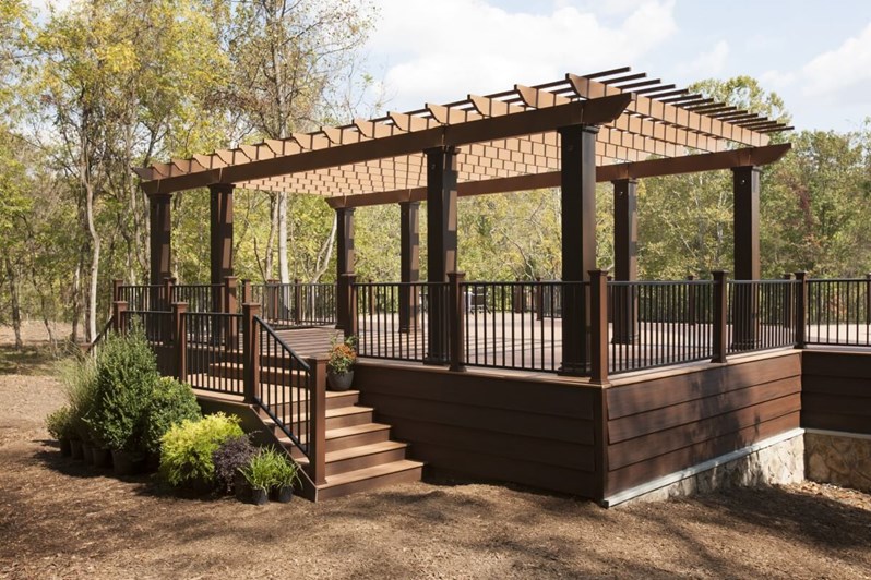 Patio with Reveal stairs and a pergola
