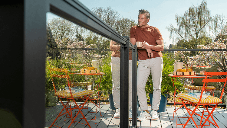 Image Deck Railing Systems Category Person Enjoying A Drink While Leaning On Deck Railing 2X