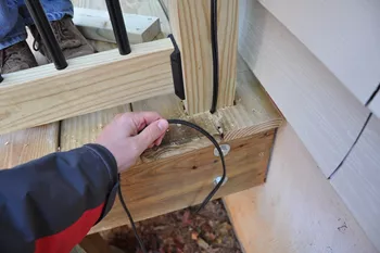 Tuck the wires under the deck.