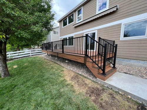 Two toned deck with brown decking and light brown border decking side view.