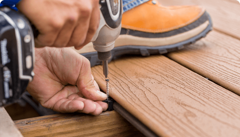 Image Person Screwing In Composite Deckboards