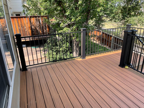 Two toned deck with brown decking and light brown border decking.