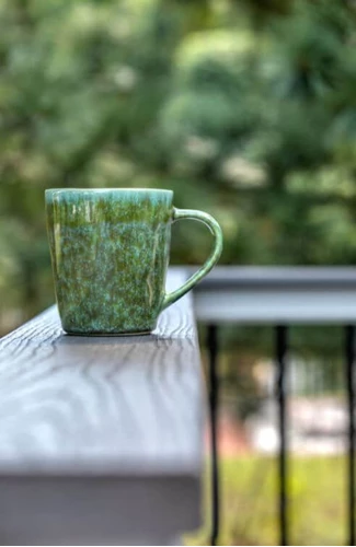 Coffee Cup On A Cocktail Railing