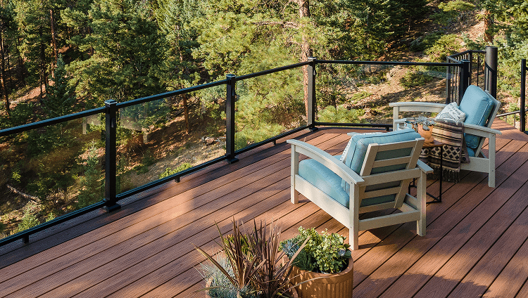 Image Design Category Composite Deck And Glass Railing System Allowing View Of Forest 2X