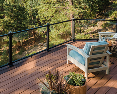 Image Design Category Composite Deck And Glass Railing System Allowing View Of Forest 2X