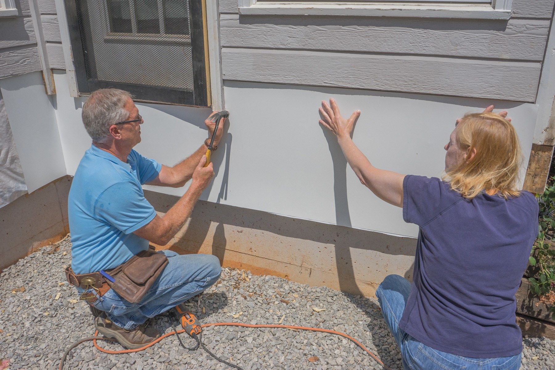 Slip the siding up and around the door
