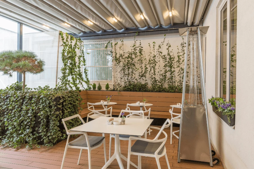 Patio with a heater next to the tables