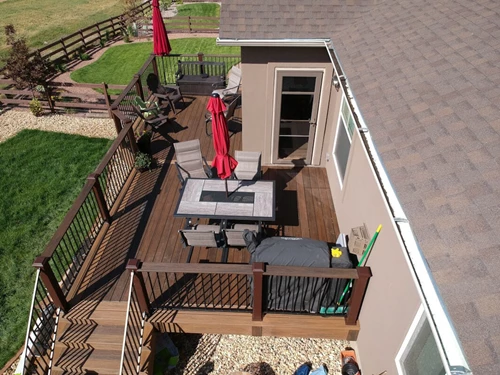 Two toned deck with light brown and dark brown deck and railing.
