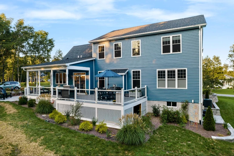 Blue house with white and gray patio