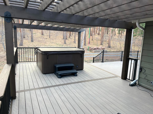 Two toned deck with gray decking and brown decking border.