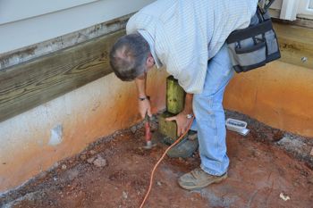 Place your foot behind the post when nailing.