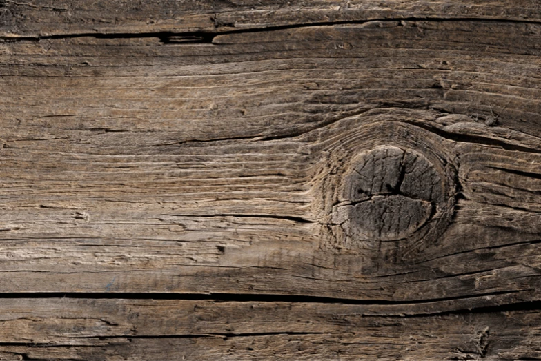 A large knot in a wooden board