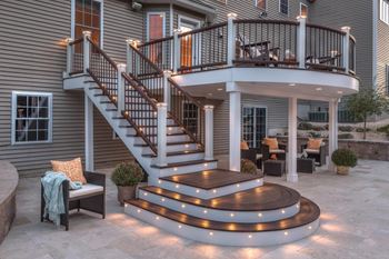 Elevated deck with lighting built into stairs, posts, and platform Elevated deck with lighting built into stairs, posts, and platform