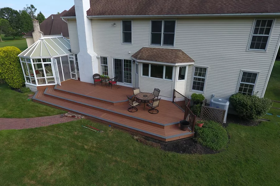 Tiki torch deck with island mist boards and bronze trex reveal railings