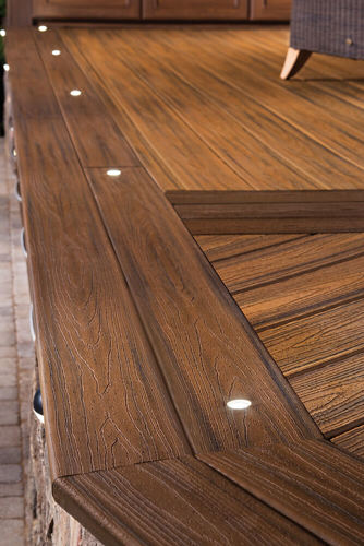Two toned deck with brown decking with blue and black undertones and deck lights.