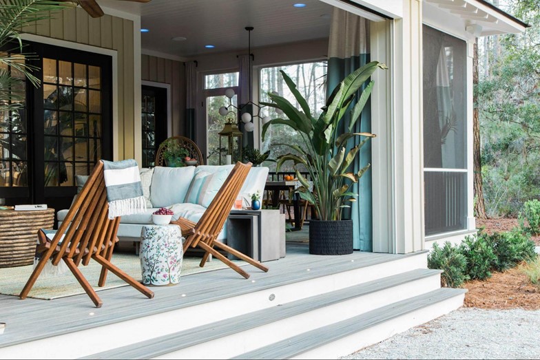 Patio with wooden chairs plants and grey box stairs