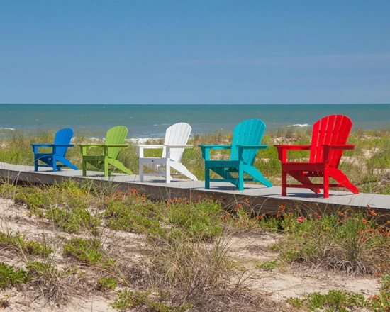 Showcases Trex Furniture on a boardwalk on the beach.