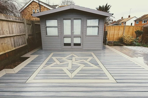 Two toned deck with beige and gray decking and a deck inlay.