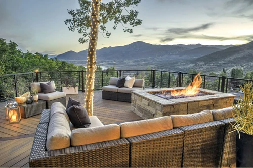 Cozy Firepit With Stone Pit And Couch In Patio Setting