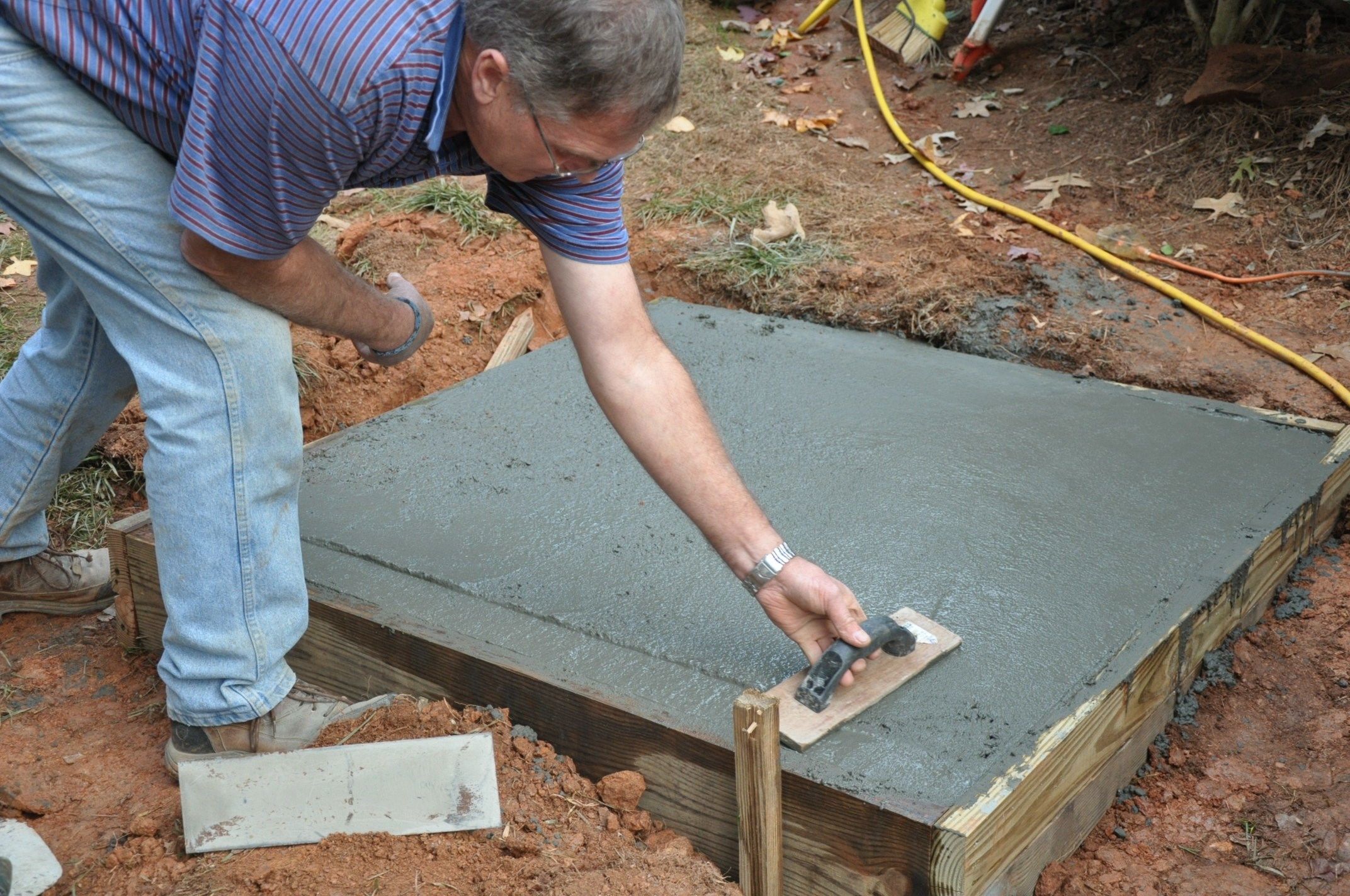 Leading Deck Stairs to a Concrete Patio by Trex
