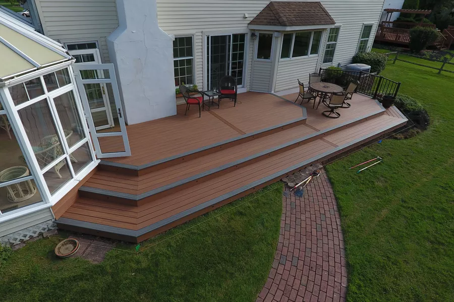 Tiki torch deck with island mist boards and bronze trex reveal railings