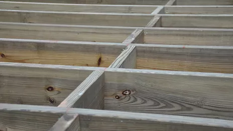 Reduce joist bounce with blocking.