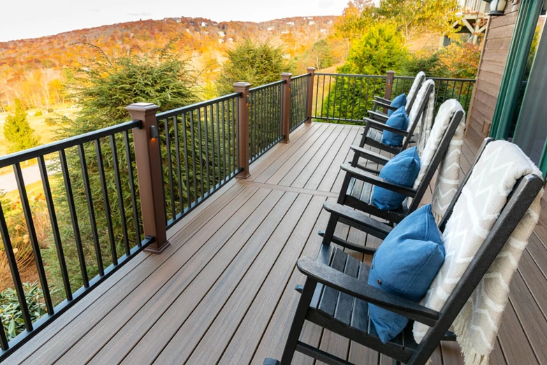 4 chairs on an elevated deck overlooking vast landscape