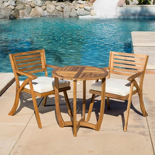 Wooden Furniture On A Pool Deck Patio