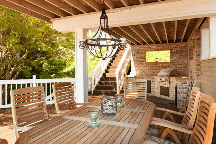 Patio with a Chandelier over a table