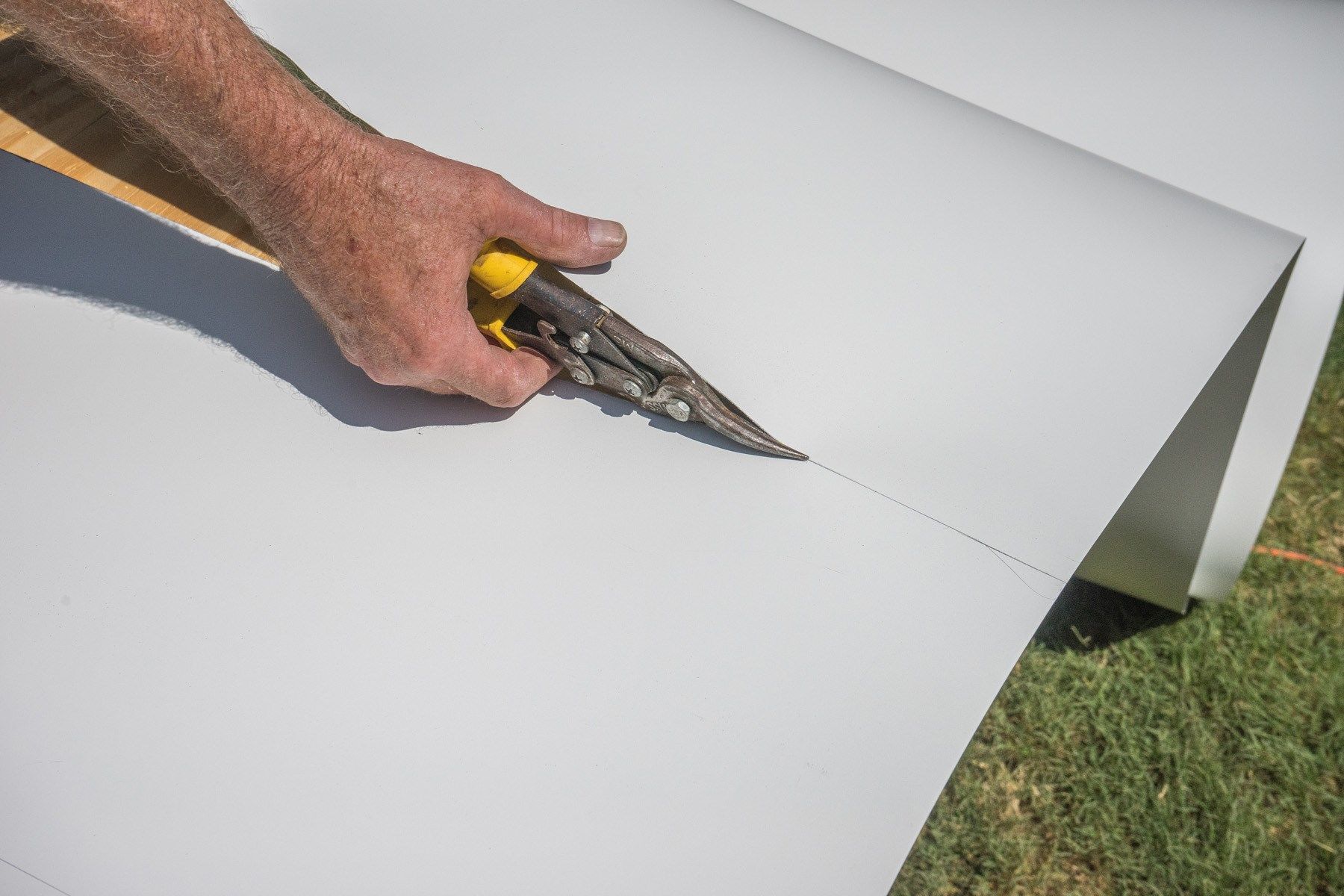 Cut the flashing with tin snips