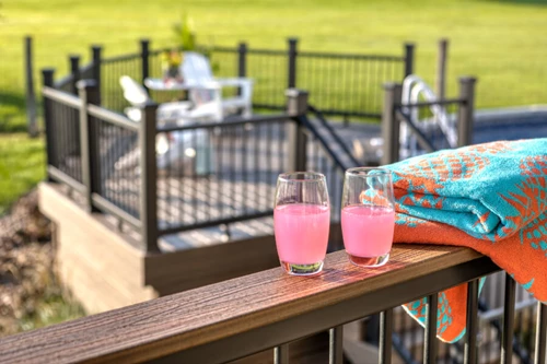 Cocktails Glasses Sitting On Top Of A Cocktail Railing