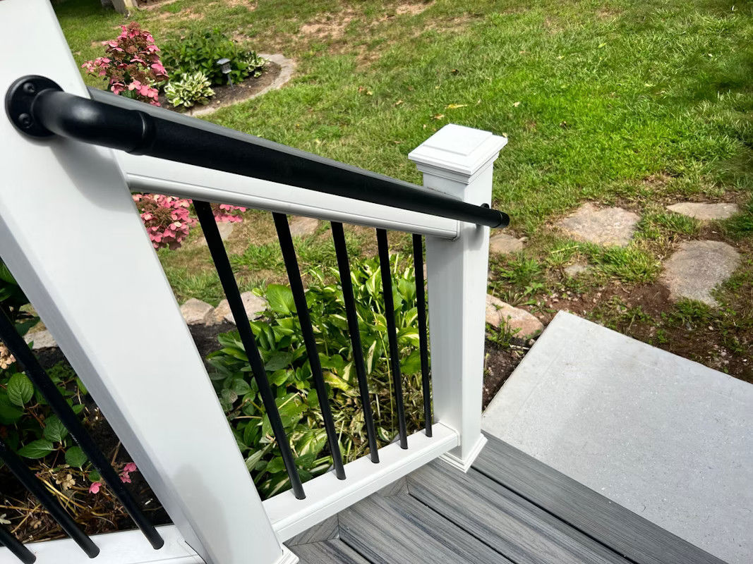 White Deck Railing With Black Hand Rail