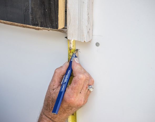 Mark below the door casing