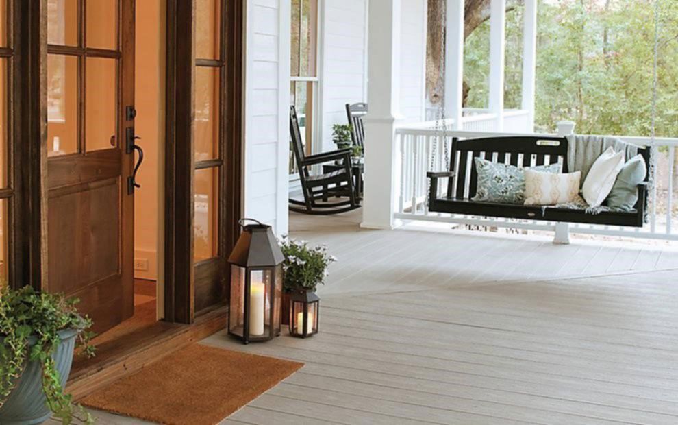 Large composite porch with porch swing and chairs