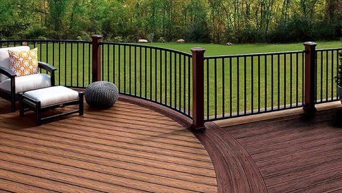 Two toned deck with light brown decking and dark brown decking and railing.
