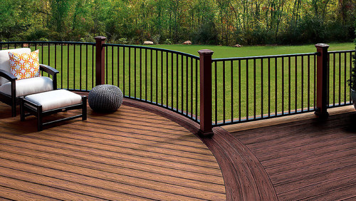Two toned deck with light brown decking and dark brown decking and railing.