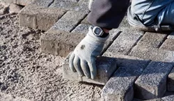 Person Laying Brick